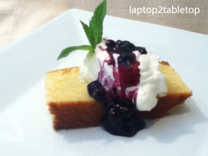lemon ricotta pound cake with mascarpone whipped cream and blueberry sauce